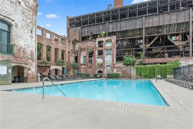 a view of a swimming pool with a patio