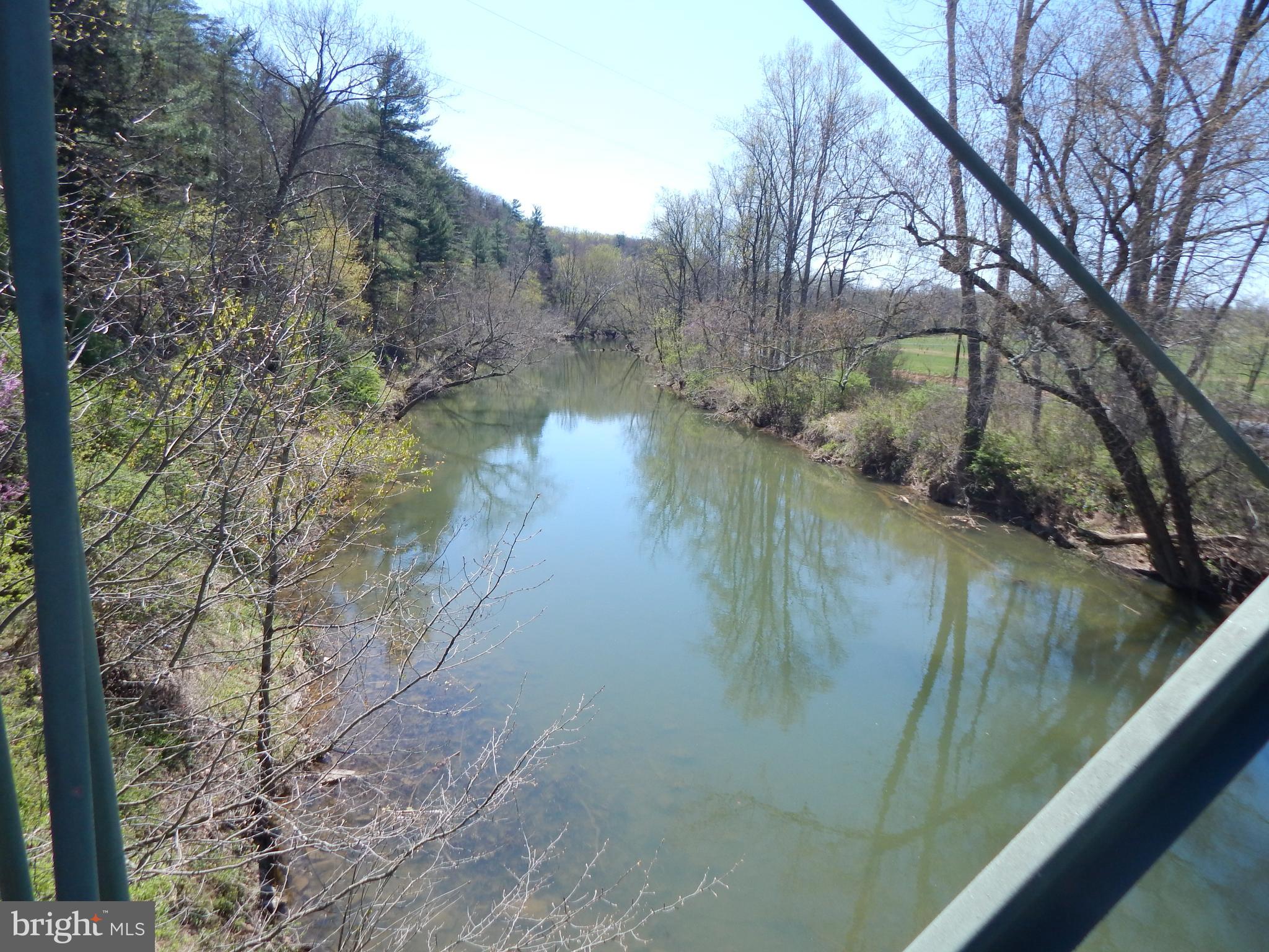 Lot 1 Cannon Hill Road Hedgesville, WV 25427 - Photo 2 of 19 a view of a lake in between two trees
