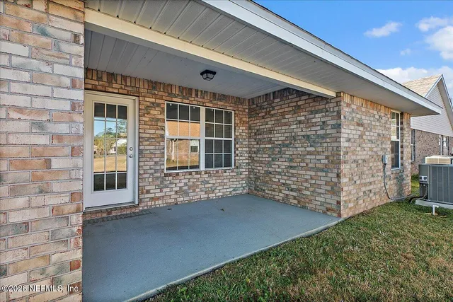 a view of front door of house with stairs