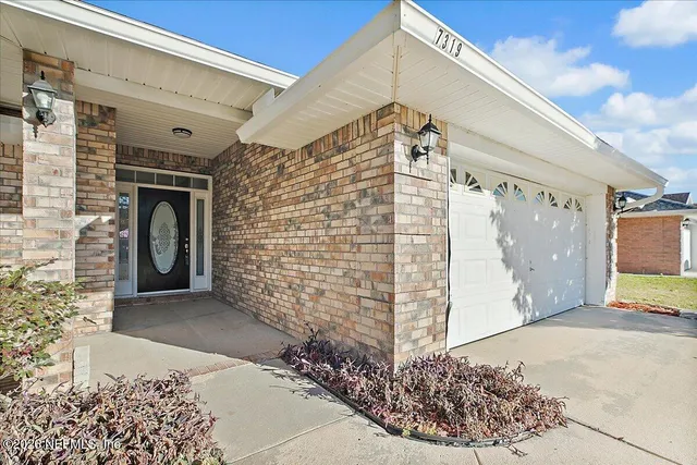 a front view of a house with a garage