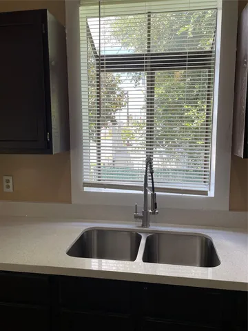 a kitchen with a sink and a window