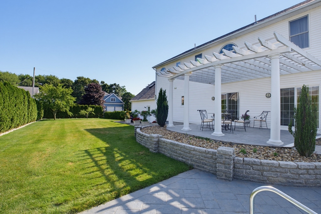 226 Olympic Road Somerset, MA 02726 - Photo 33 of 42 a view of a swimming pool with a garden