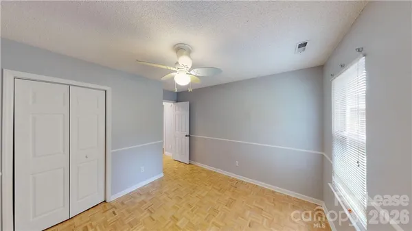 a bathroom with a toilet and a bathtub