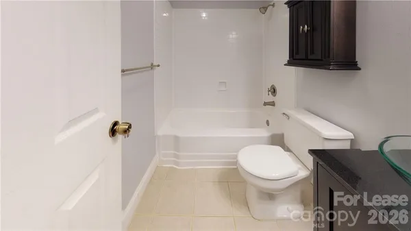 a view of room with window and wooden floor