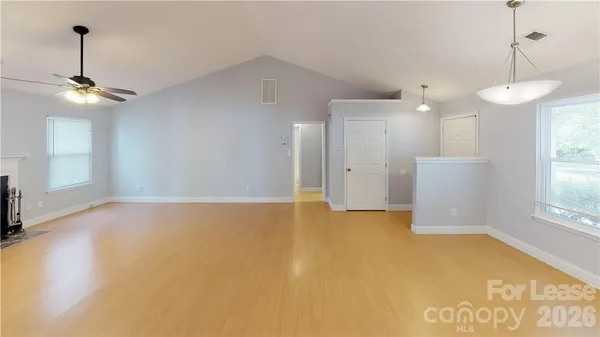 a view of an empty room with a window