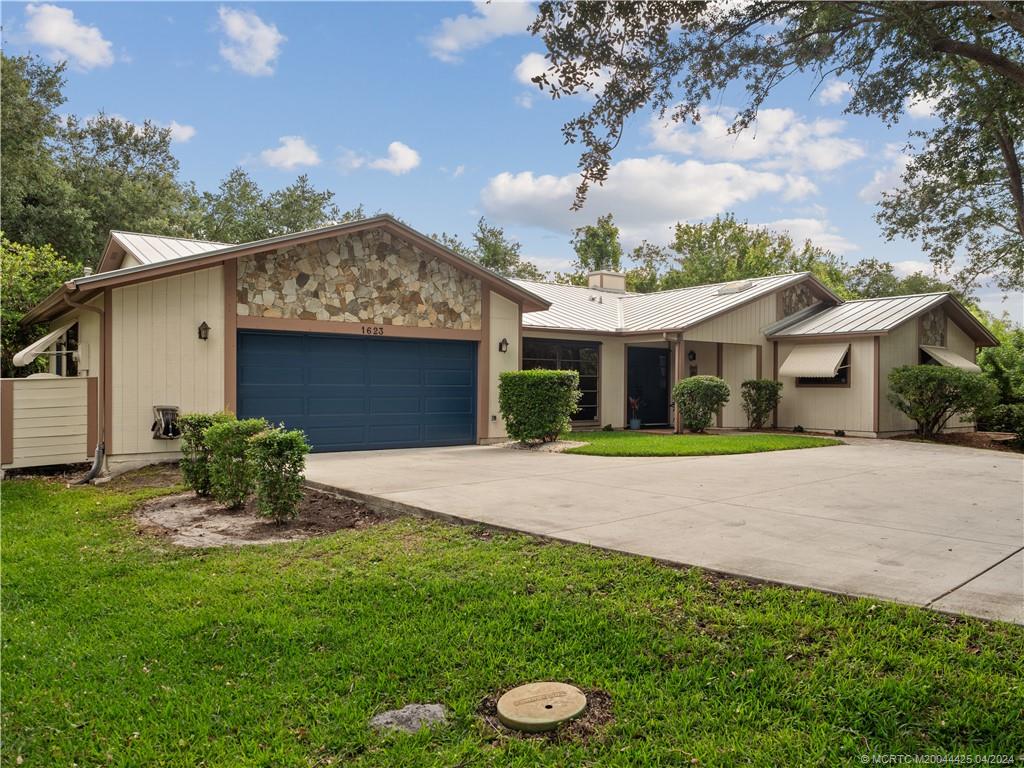 1623 Southwest Gregor Way Stuart, FL 34997 - Photo 6 of 42 New Concrete Drive and Garage Door in 2021