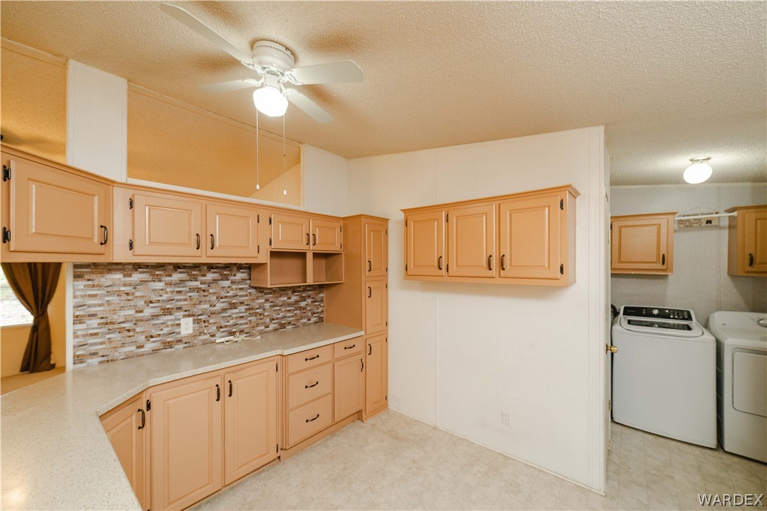 3003 Hualapai Mountain Road Kingman, AZ 86401 - Photo 11 of 49 a kitchen with granite countertop a sink cabinets stainless steel appliances and a counter top space