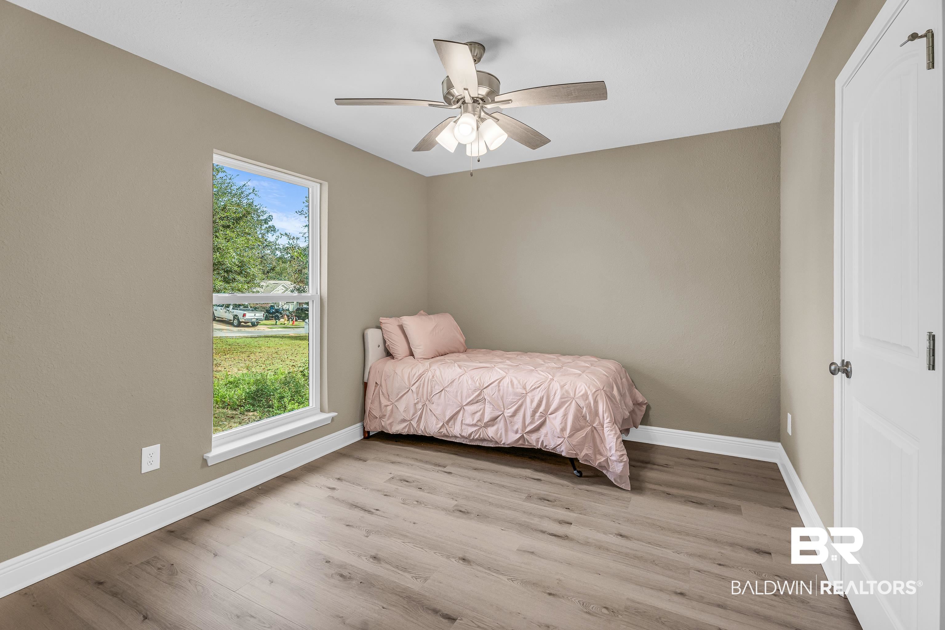 9206 Greenleaf Drive Daphne, AL 36527 - Photo 19 of 32 Bedroom featuring light wood-style floors and a ceiling fan