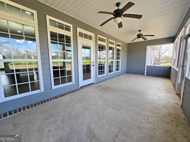 a view of a field with an trees
