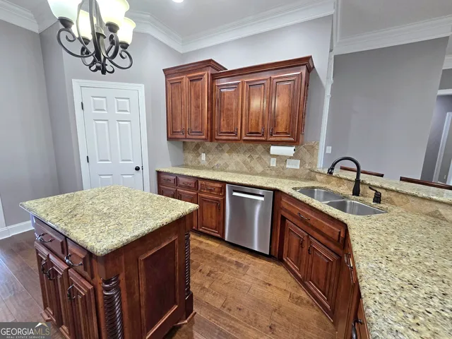 a kitchen with a sink stove and cabinets