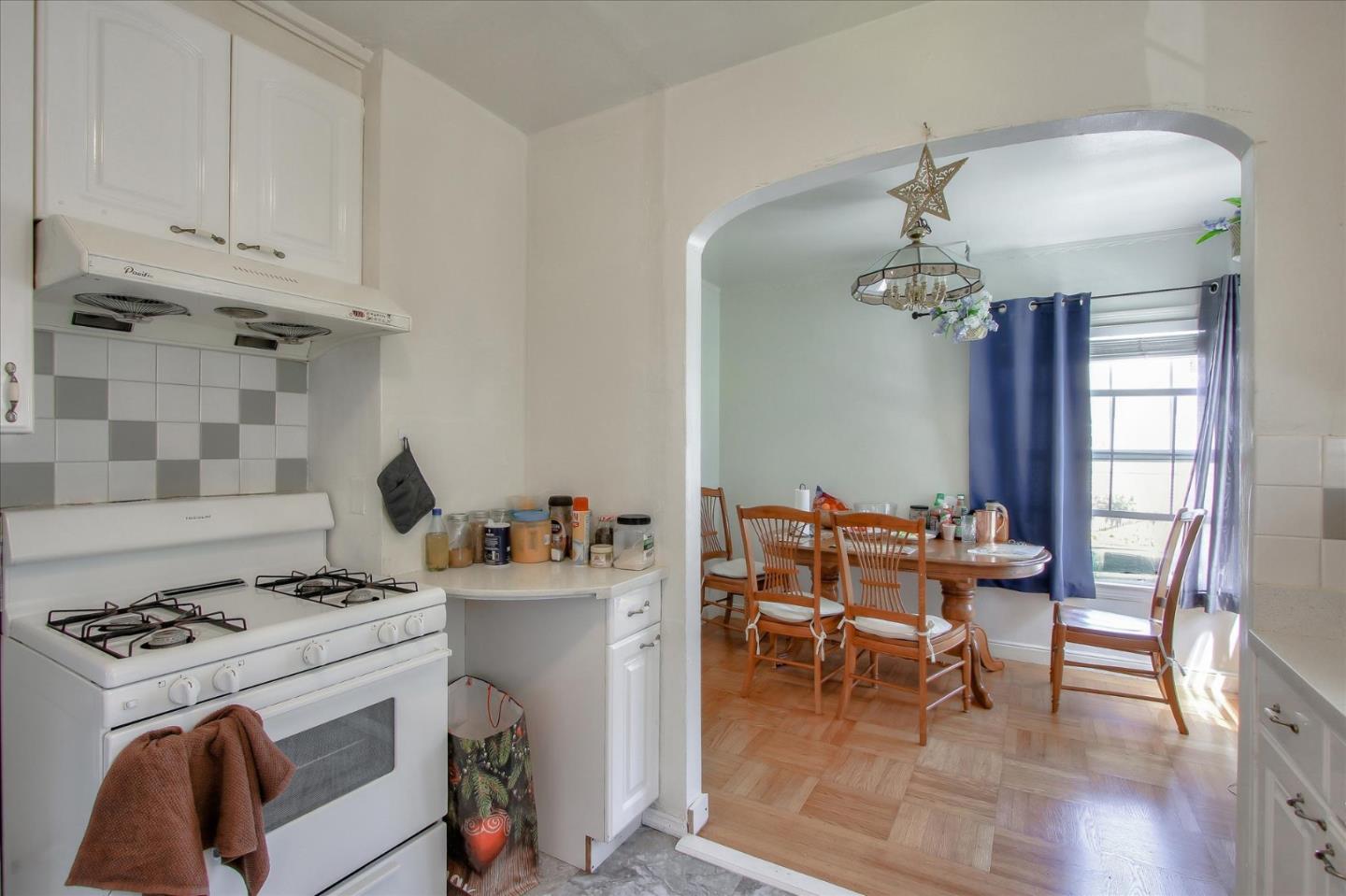 Willits Street Daly City, CA 94014 - Photo 12 of 50 a kitchen with a stove and white cabinets