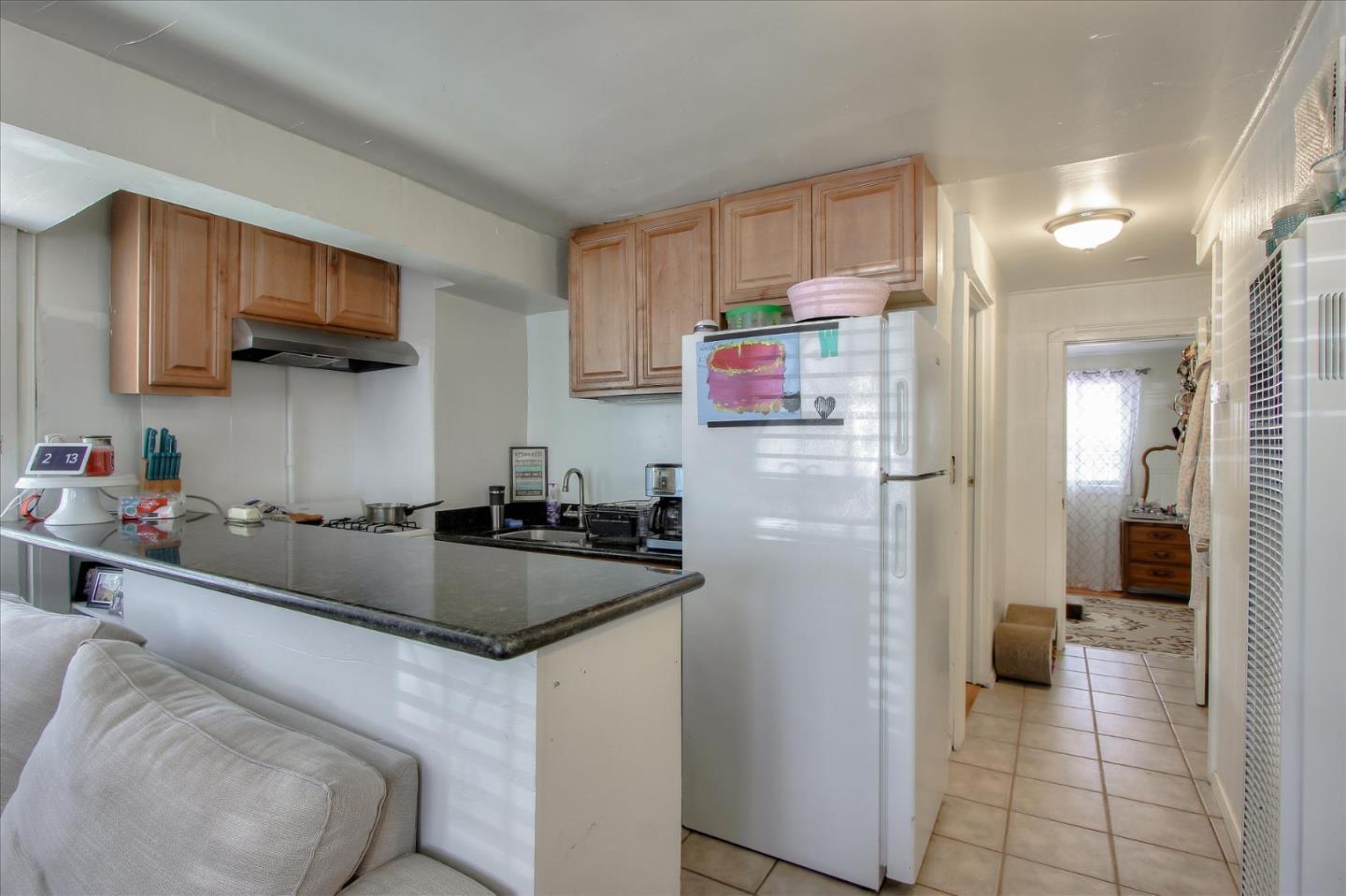 Willits Street Daly City, CA 94014 - Photo 15 of 50 a kitchen with stainless steel appliances granite countertop a refrigerator and a sink