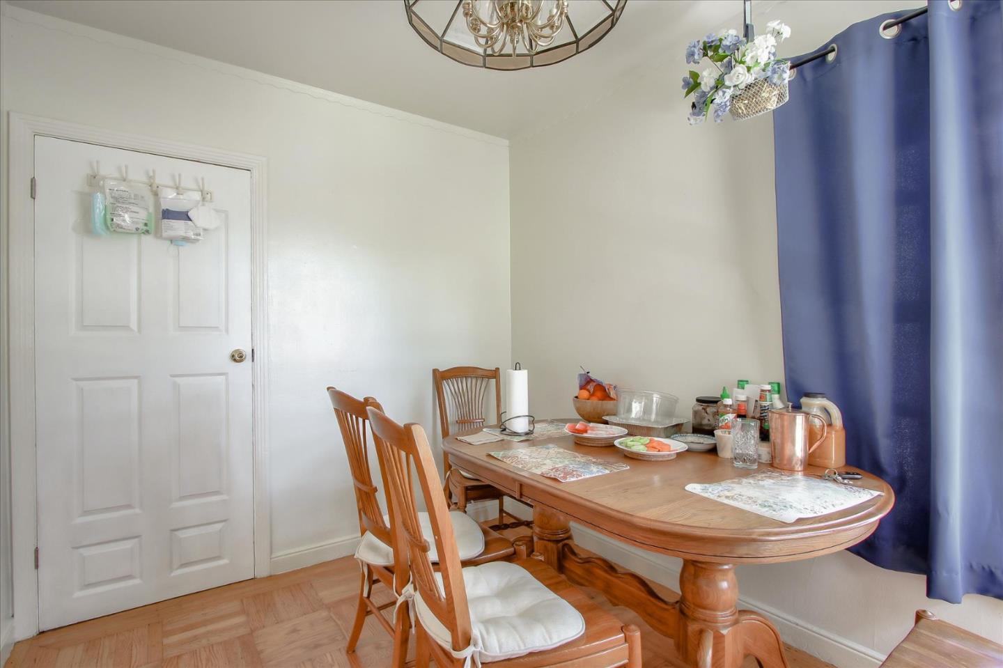 Willits Street Daly City, CA 94014 - Photo 19 of 50 a dining room with furniture potted plants and wooden floor