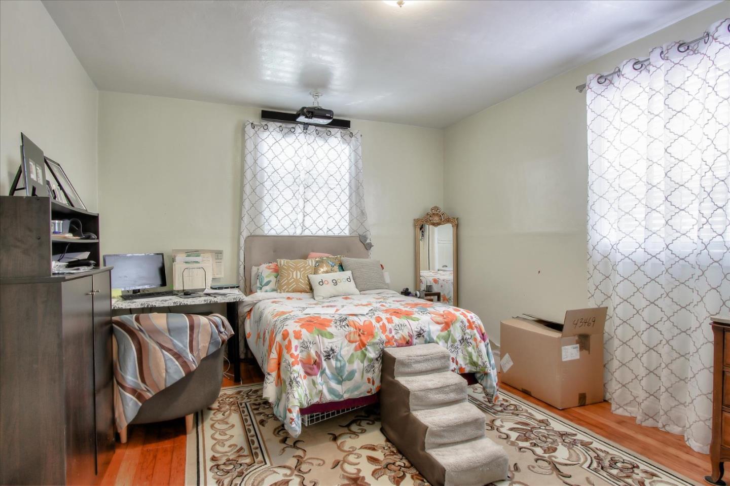 Willits Street Daly City, CA 94014 - Photo 25 of 50 a bedroom with a bed and wooden floor