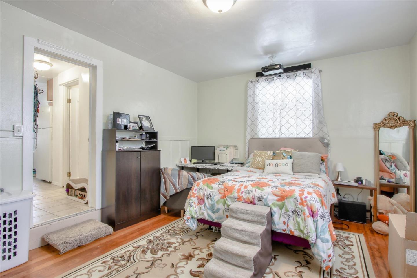 Willits Street Daly City, CA 94014 - Photo 26 of 50 a bedroom with a bed and a refrigerator