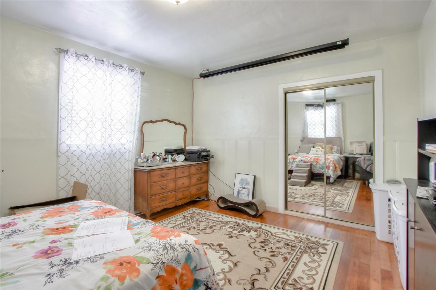 Willits Street Daly City, CA 94014 - Photo 28 of 50 a bedroom with a bed and wooden floor