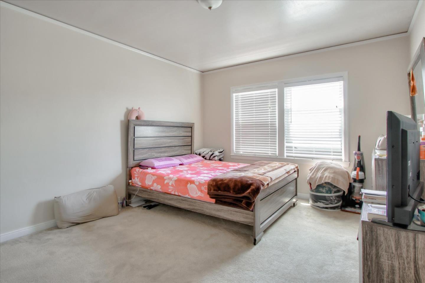 Willits Street Daly City, CA 94014 - Photo 30 of 50 a bedroom with a bed flat screen tv and window