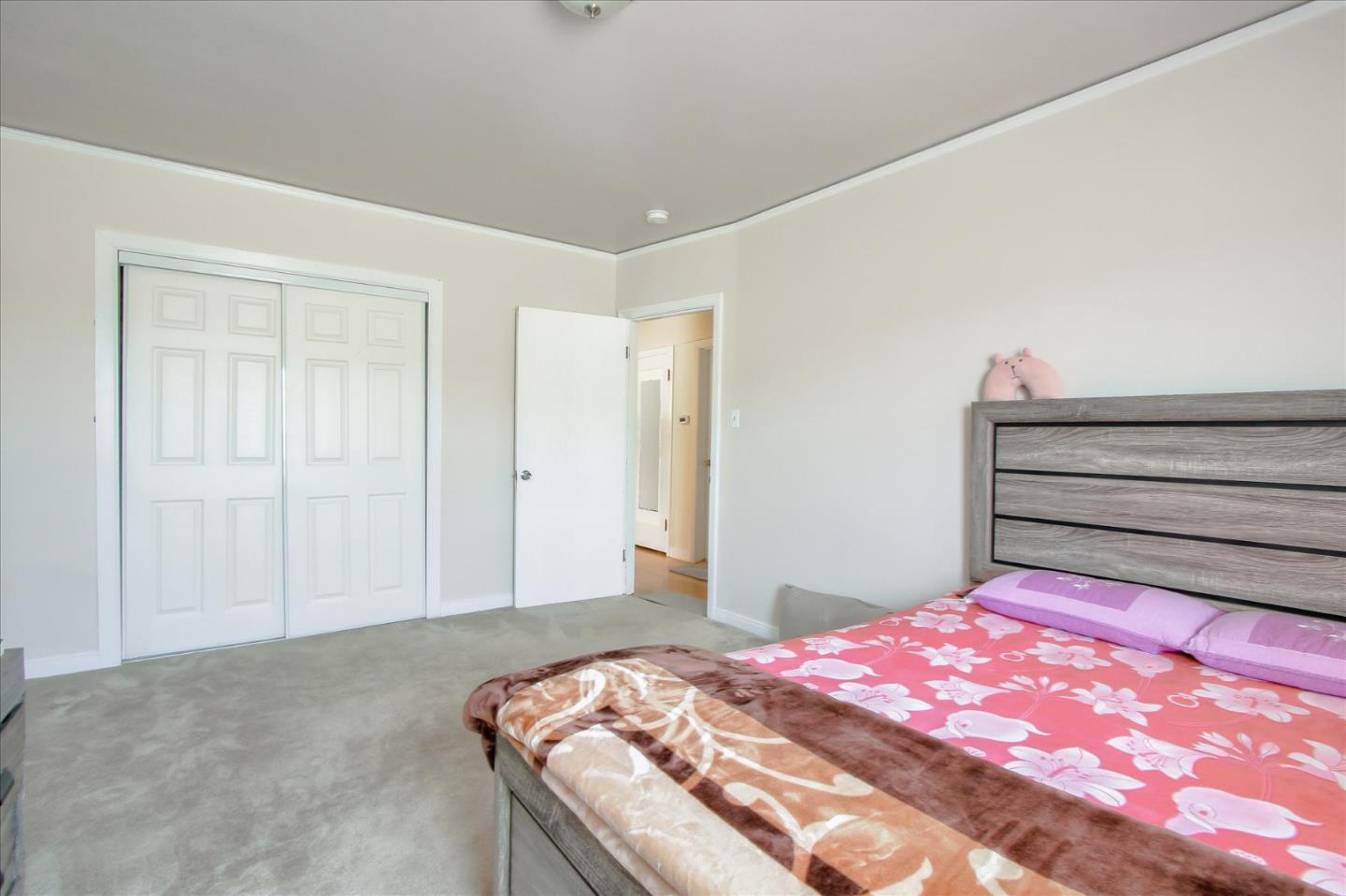 Willits Street Daly City, CA 94014 - Photo 31 of 50 a bedroom with a bed and a mirror