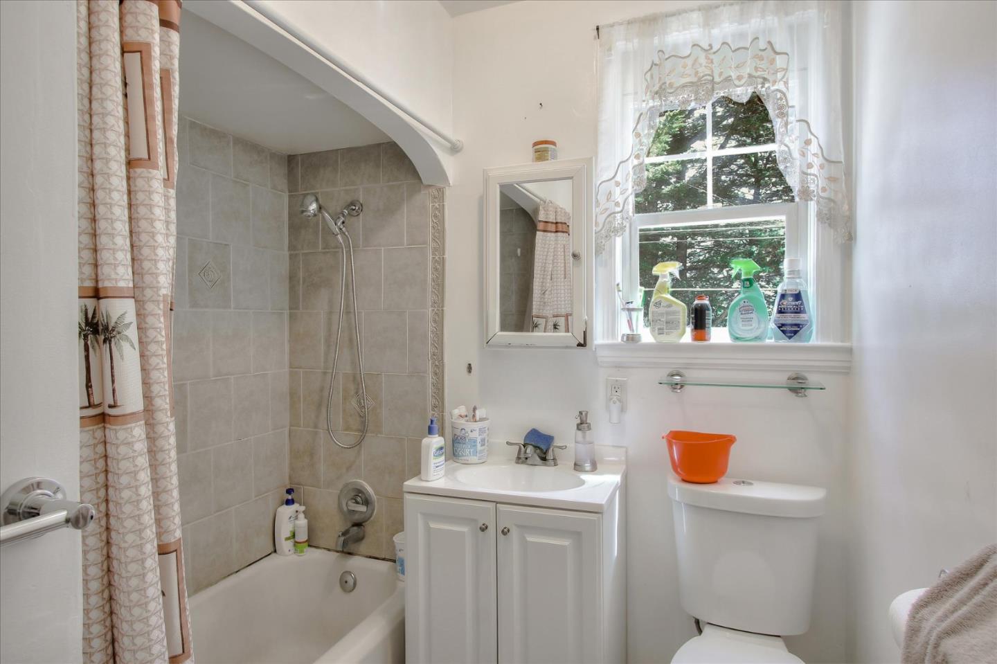Willits Street Daly City, CA 94014 - Photo 36 of 50 a bathroom with a sink a window and a shower