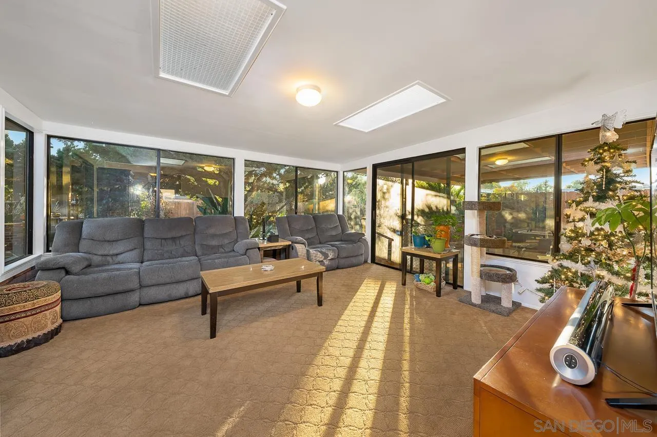 1225 Andover Road El Cajon, CA 92019 - Photo 15 of 27 a living room with furniture and a floor to ceiling window