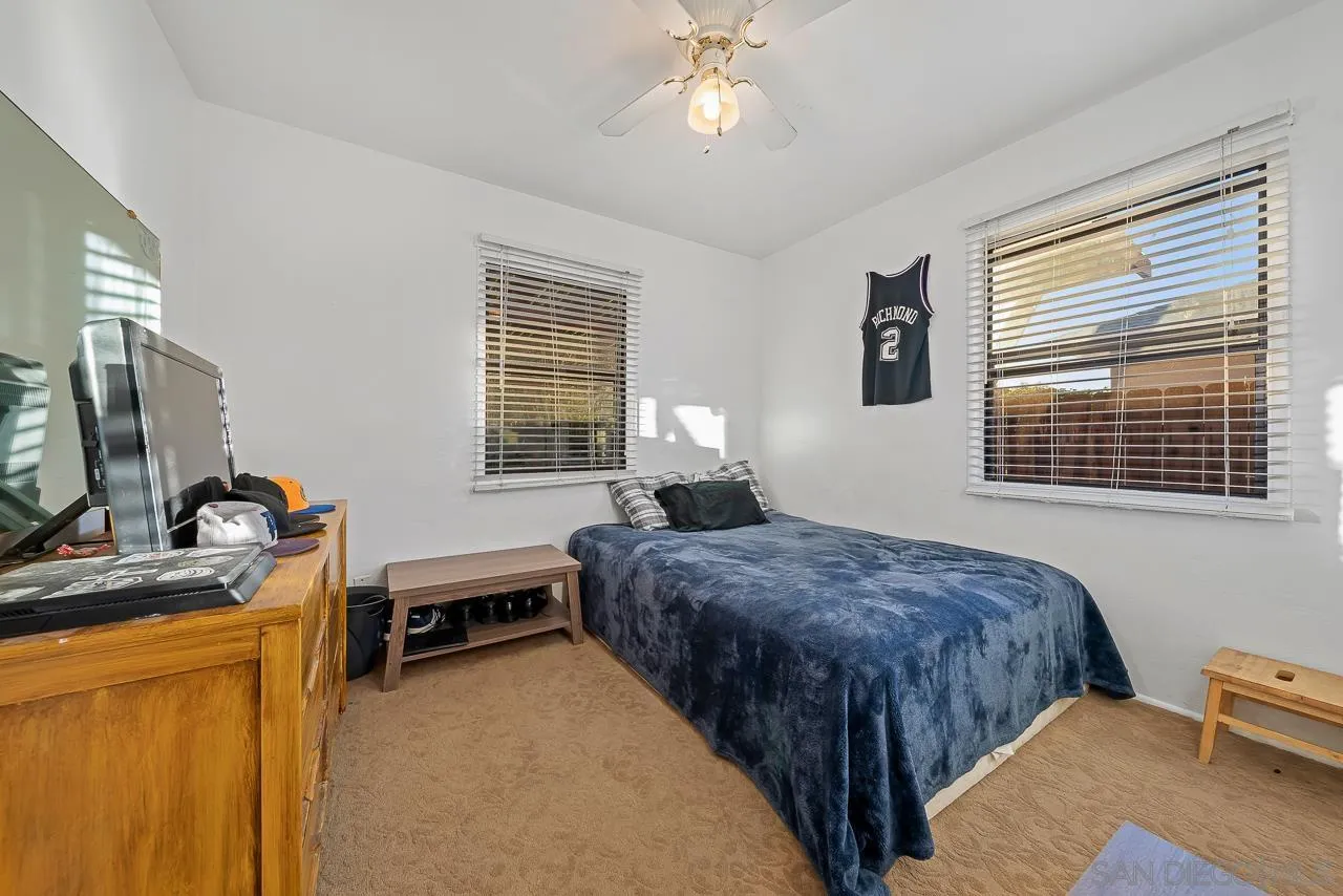 1225 Andover Road El Cajon, CA 92019 - Photo 18 of 27 a bedroom with a bed and a flat screen tv