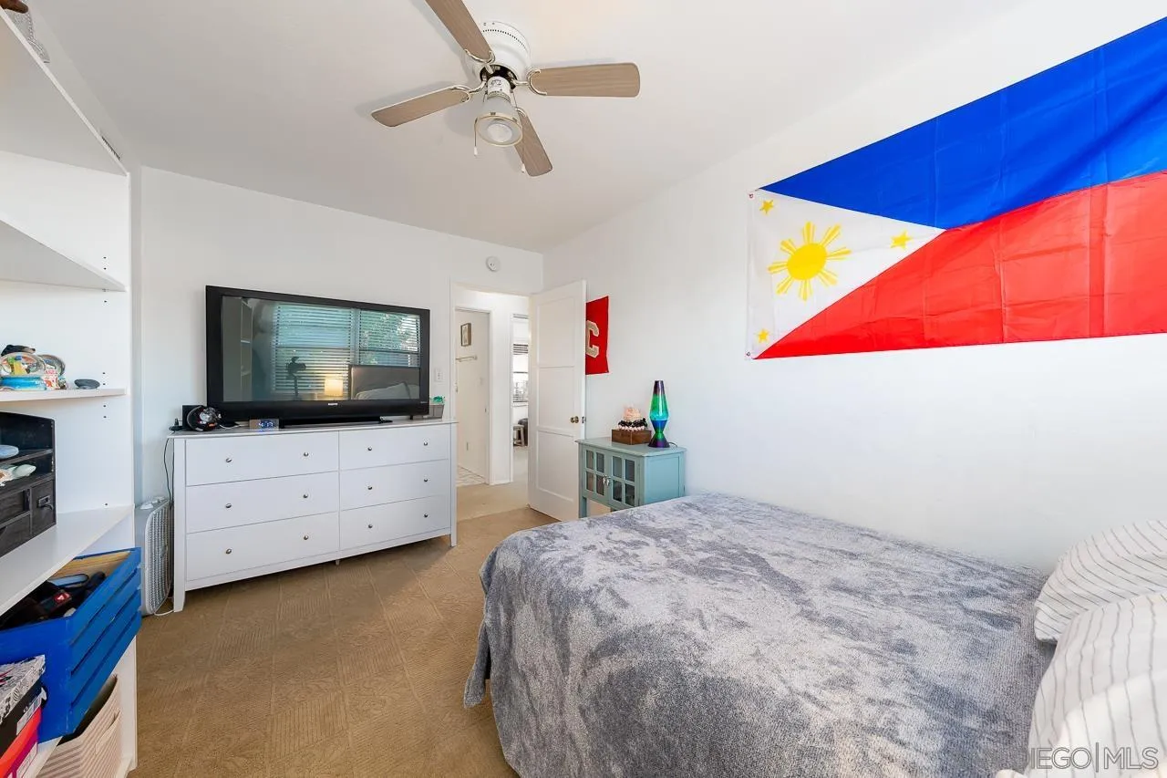 1225 Andover Road El Cajon, CA 92019 - Photo 19 of 27 a bedroom with a bed and flat screen tv