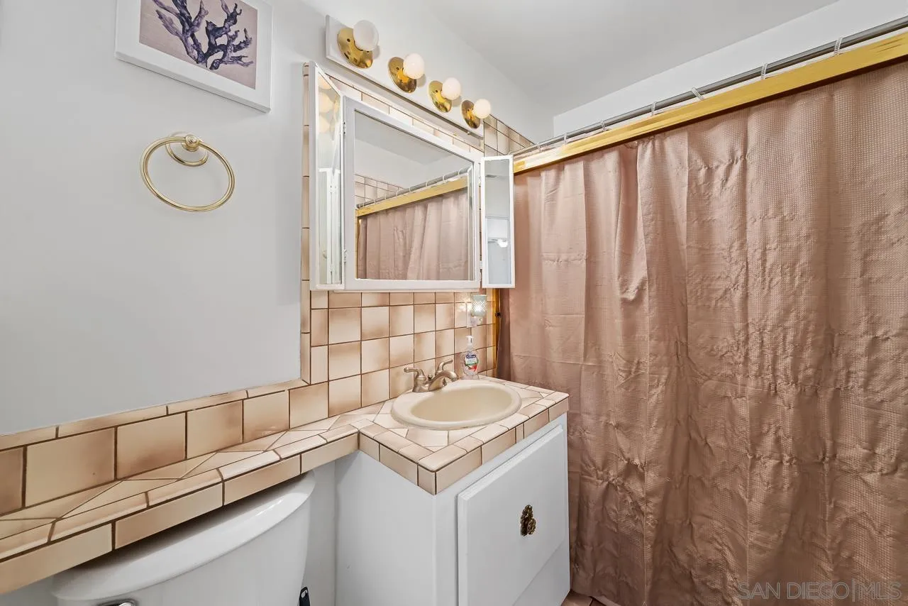 1225 Andover Road El Cajon, CA 92019 - Photo 20 of 27 a bathroom with a sink and a mirror