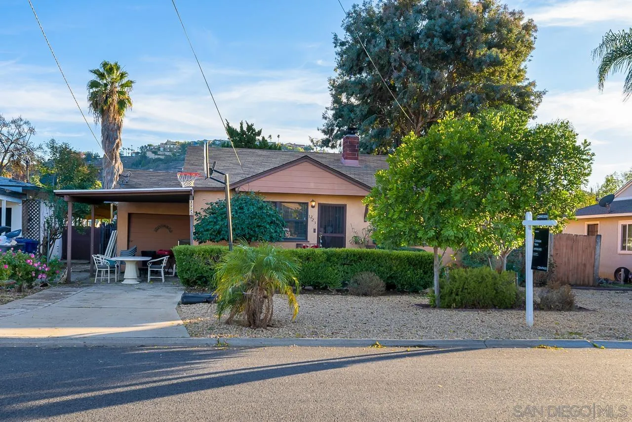 1225 Andover Road El Cajon, CA 92019 - Photo 2 of 27 a front view of a house with a garden and plants