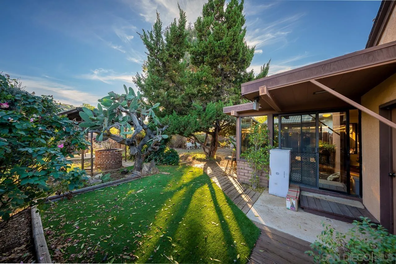 1225 Andover Road El Cajon, CA 92019 - Photo 21 of 27 a backyard of a house with barbeque oven table and chairs