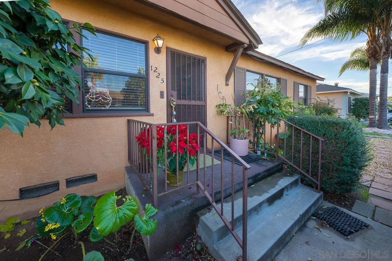 1225 Andover Road El Cajon, CA 92019 - Photo 5 of 27 a view of a house with brick walls and potted plants