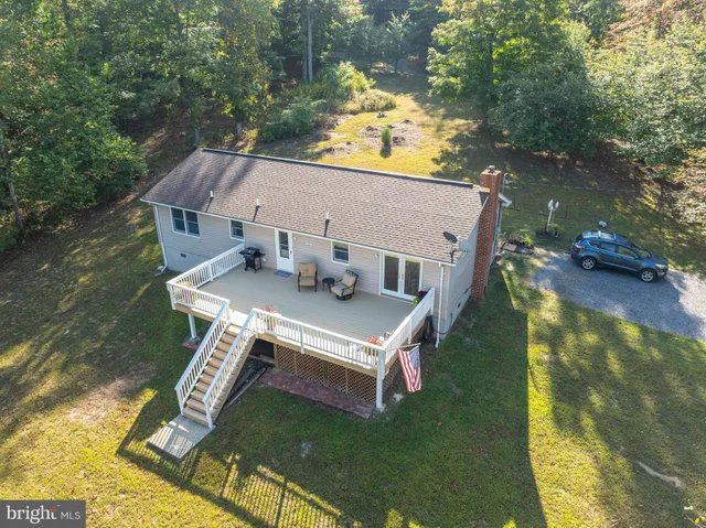 a aerial view of a house with swimming pool