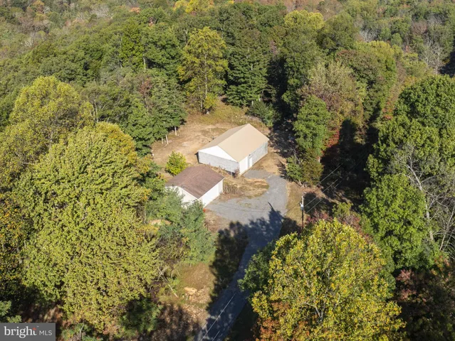 a view of a house with a yard and garage