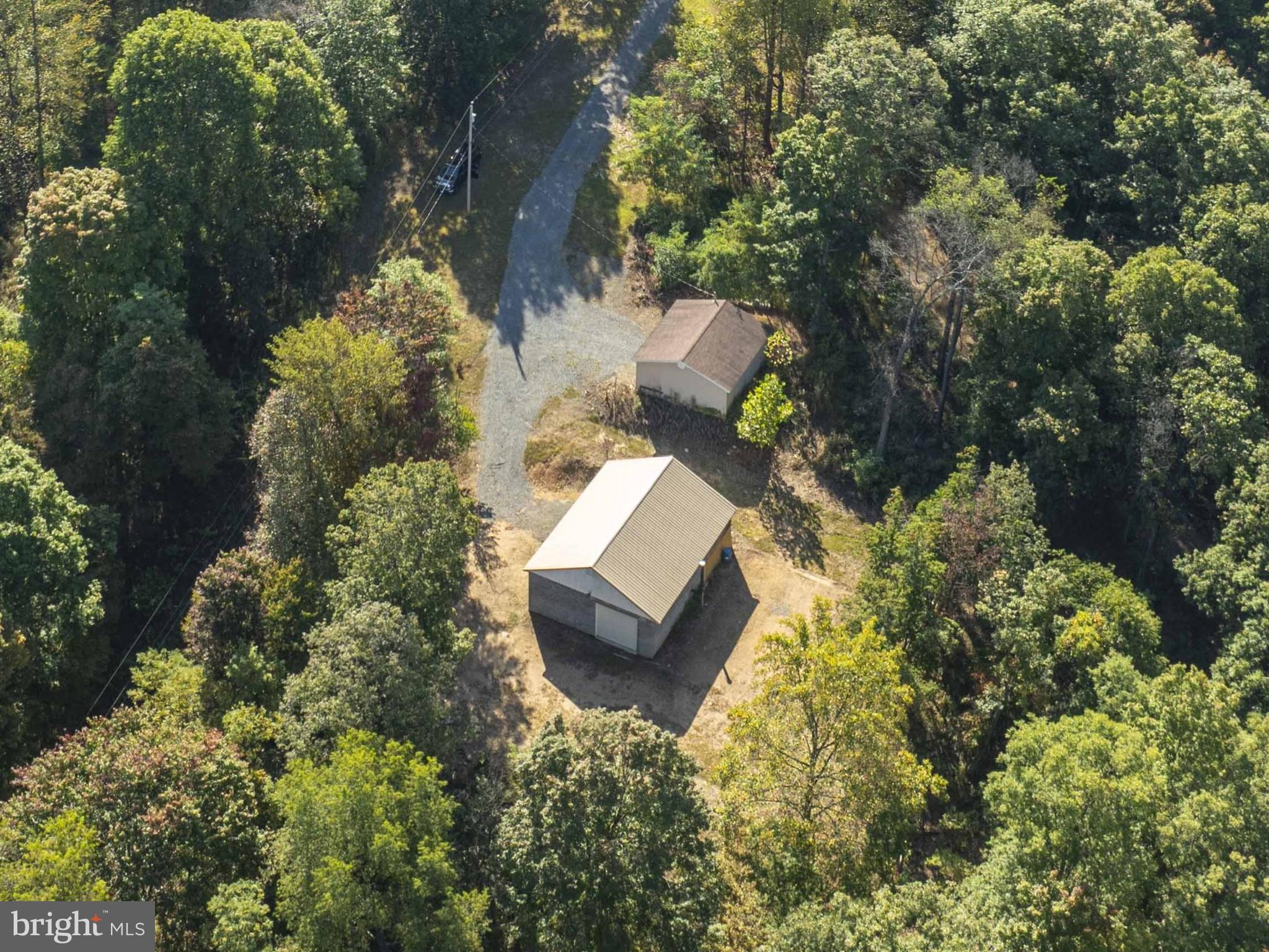3225 Magnolia Road Great Cacapon, WV 25422 - Photo 13 of 59 an aerial view of a house with a yard and garden