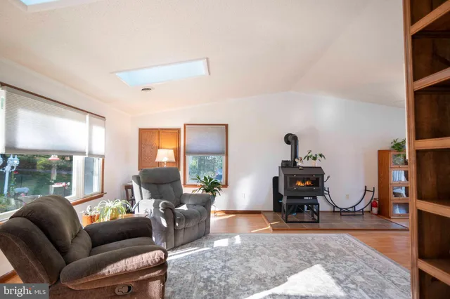 a kitchen with a sink window and cabinets