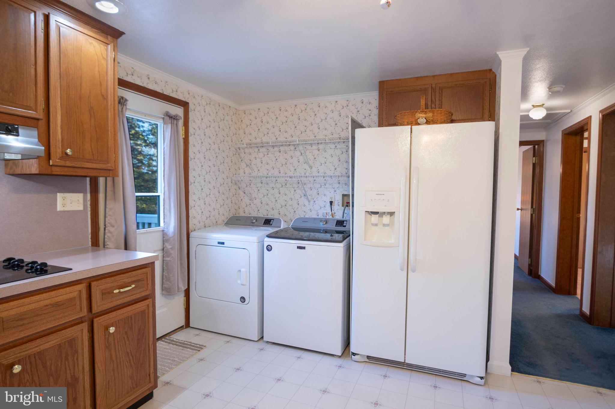 3225 Magnolia Road Great Cacapon, WV 25422 - Photo 21 of 59 a white refrigerator freezer sitting in a kitchen