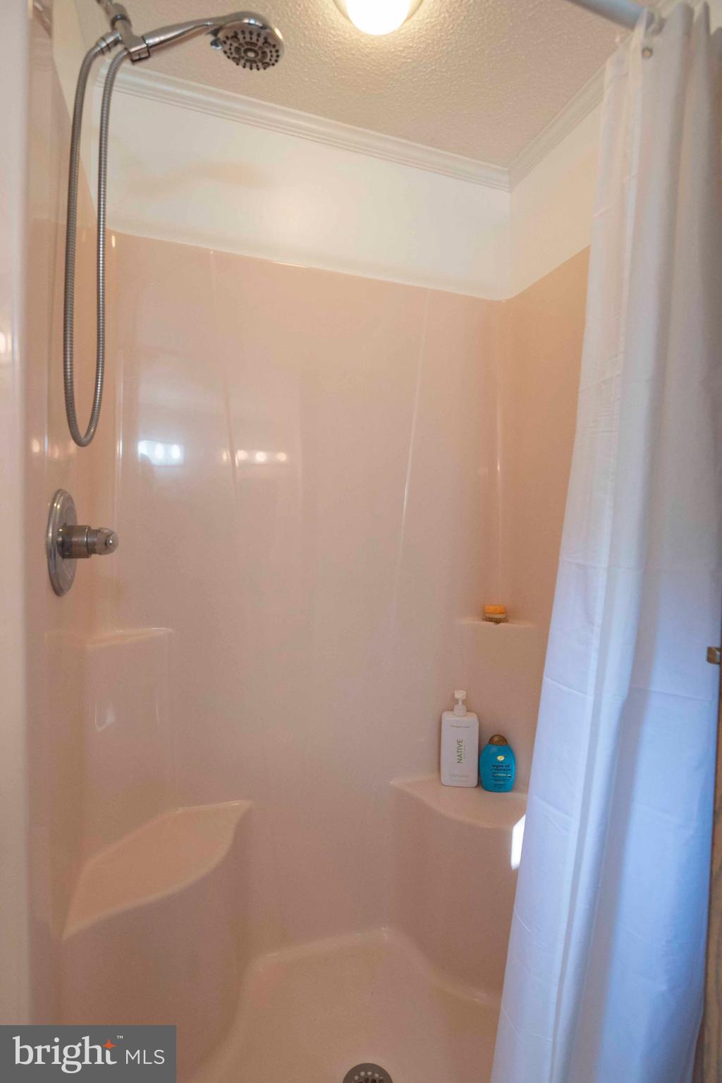 3225 Magnolia Road Great Cacapon, WV 25422 - Photo 30 of 59 a bathroom with a bath tub