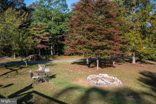 a balcony with wooden floor and furniture