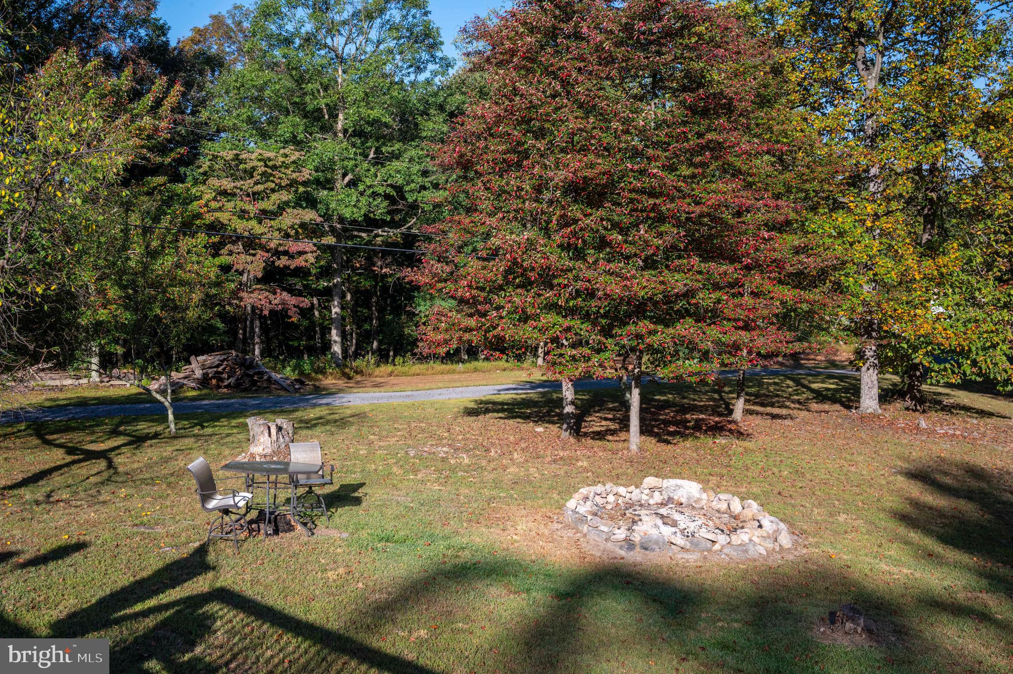 3225 Magnolia Road Great Cacapon, WV 25422 - Photo 33 of 59 a view of a lake with houses