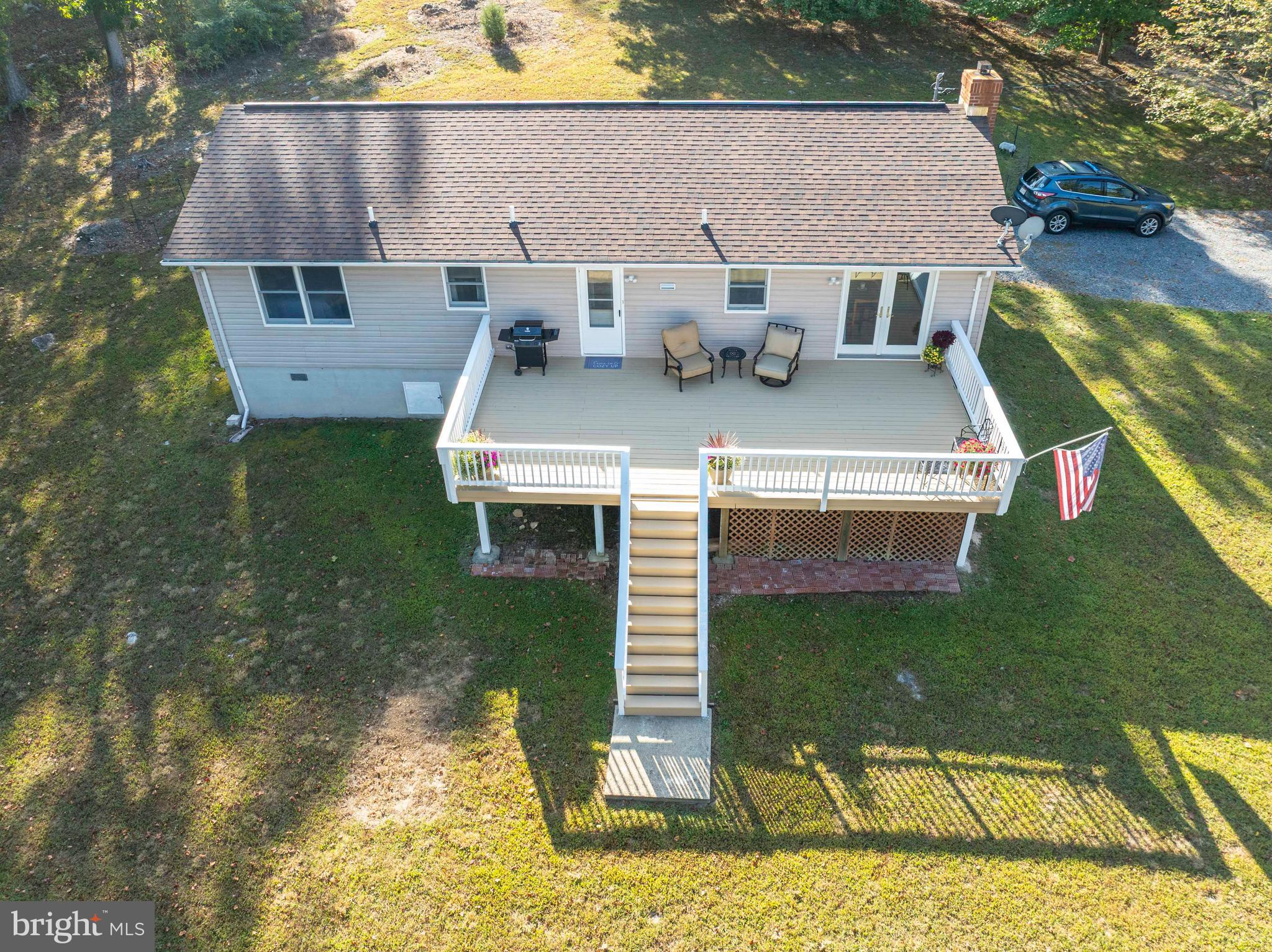 3225 Magnolia Road Great Cacapon, WV 25422 - Photo 34 of 59 aerial view of a house with backyard fountain and sitting area