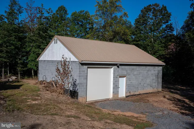 a view of a backyard of the house