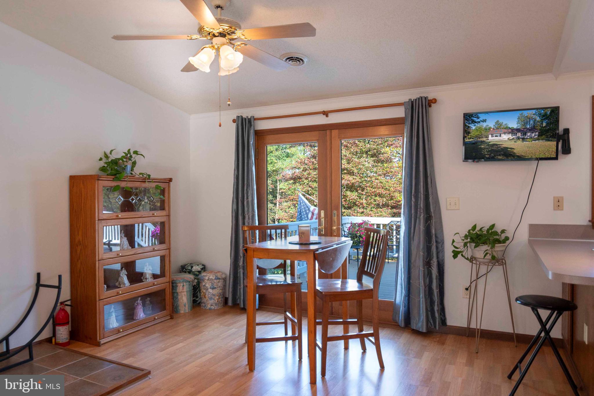 3225 Magnolia Road Great Cacapon, WV 25422 - Photo 7 of 59 a view of a livingroom with furniture window and wooden floor