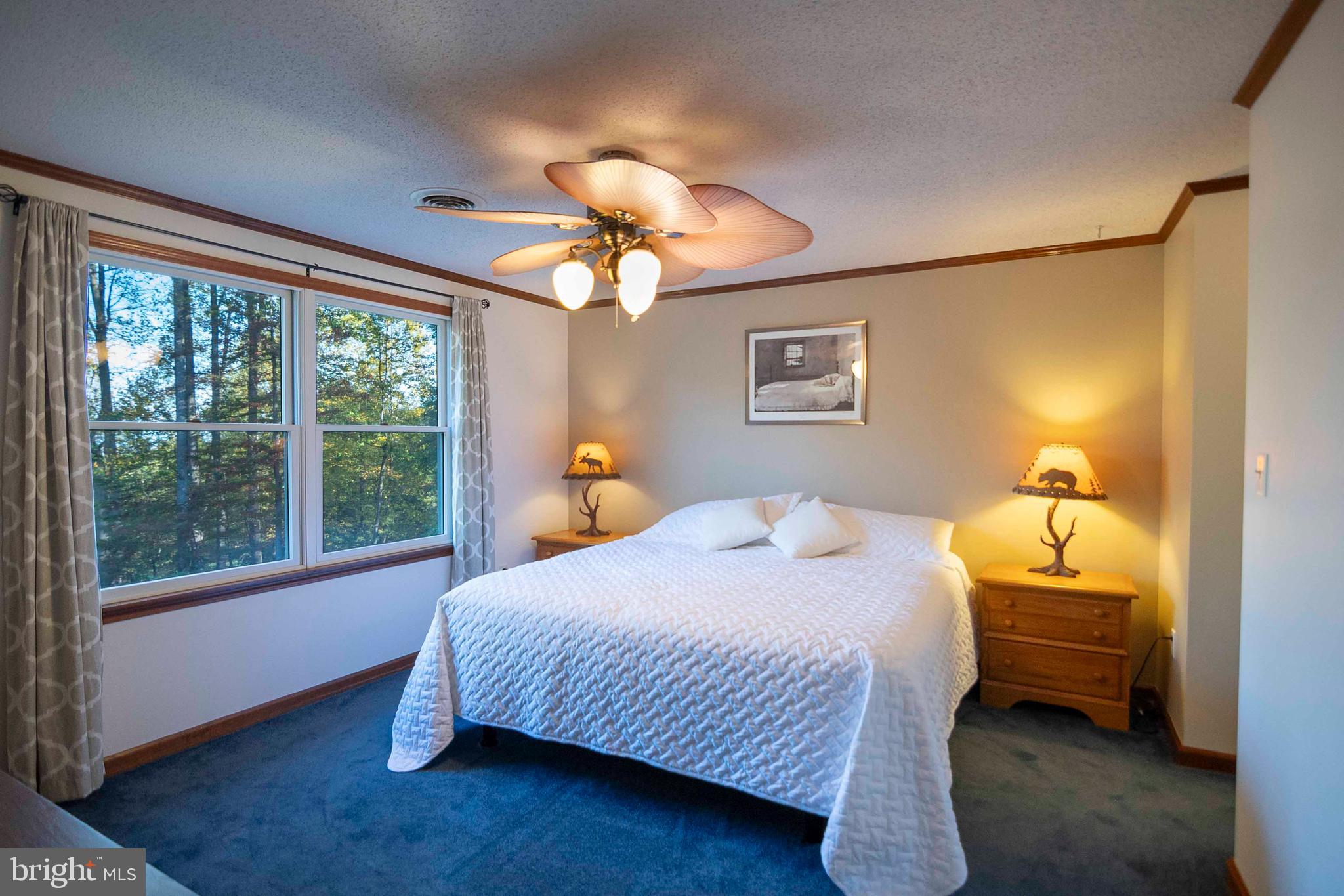 3225 Magnolia Road Great Cacapon, WV 25422 - Photo 8 of 59 a bedroom with a bed and a window