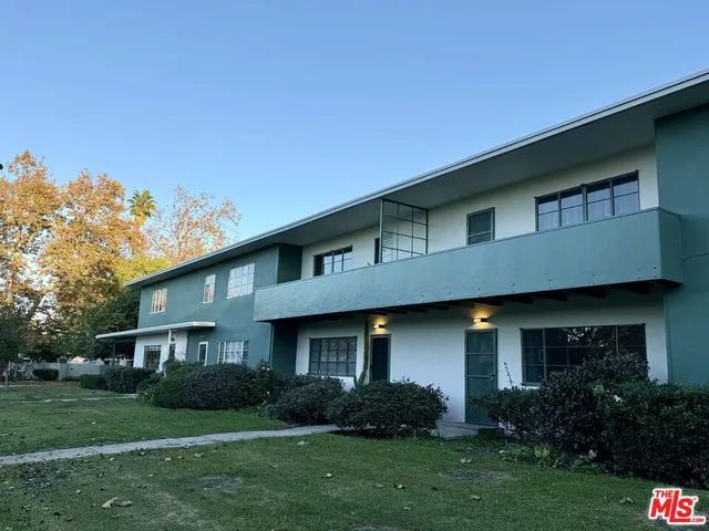 a view of a park with large trees