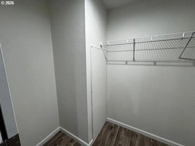 a view of an empty room and wooden floor