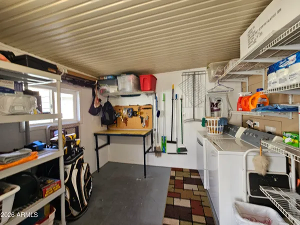 a utility room with multiple dryer and washer