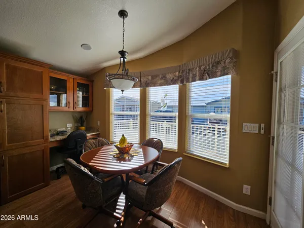 a living room with furniture couches and a large window
