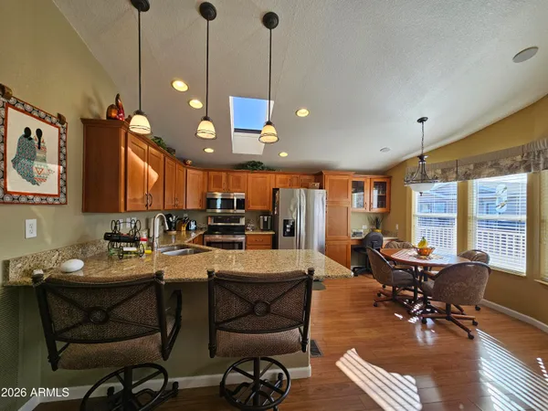 a view of a dining room with furniture window and outside view