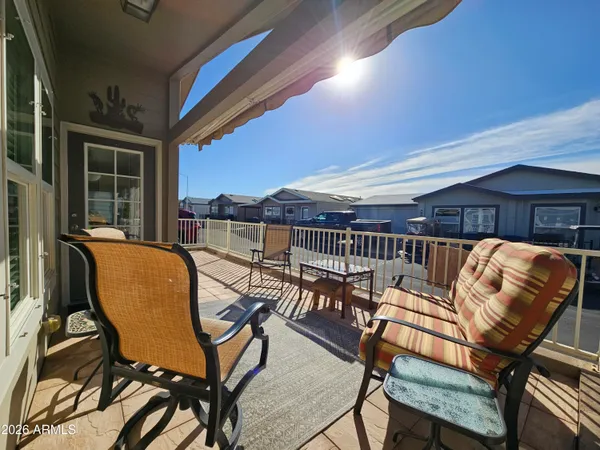 a roof deck with a table and chairs