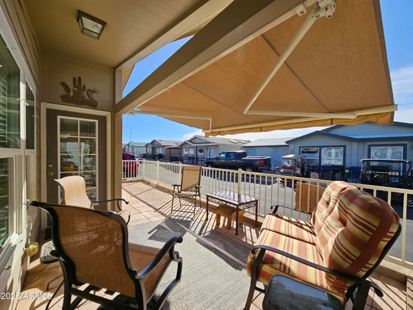 a view of a patio with swimming pool table and chairs
