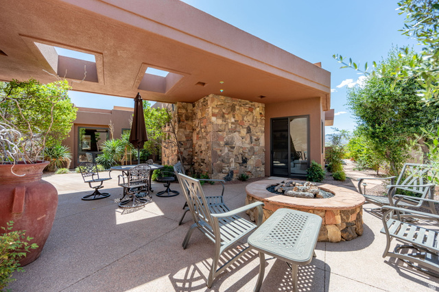2331 West Entrada Trail, Unit 61 St. George, UT 84770 - Photo 6 of 69 Expansive outdoor patio featuring a built-in stone fire pit